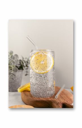 Chia water in a glass with lemon. Healthy detox drink.