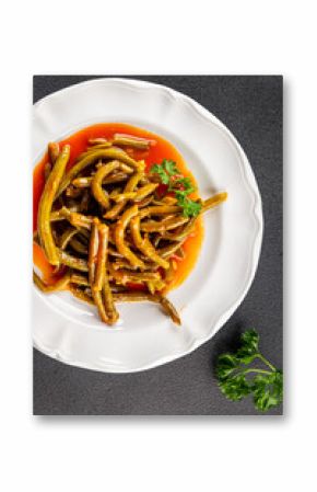 Green beans tomato sauce fresh delicious gourmet food background on the table rustic food top view copy space keto and paleo diet vegetarian and vegan food