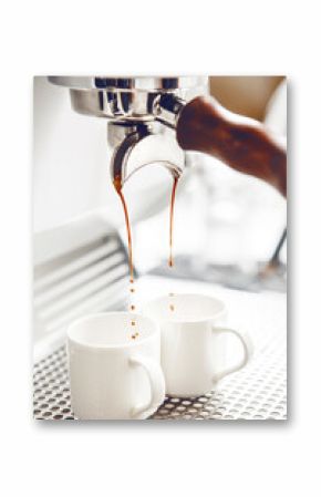 Close-up of Rich Espresso Pouring From Portafilter Into White Cups, Capturing Brewing Moment. 