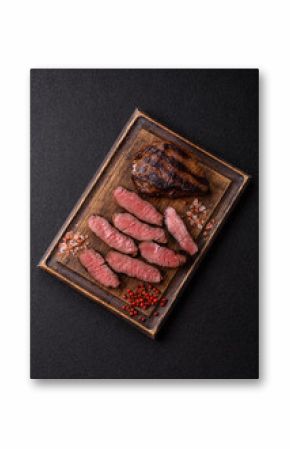 Grilled beef steak meat with salt and pepper. Beef steak grilled on a barbecue