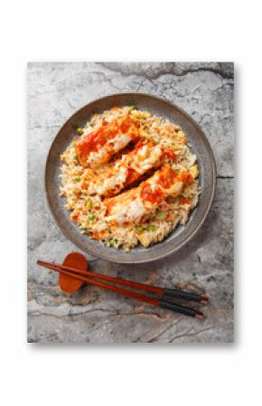 Hong Kong Baked Pork Chop Rice or guk ju pa fan closeup in a plate on the table. Vertical top view from above