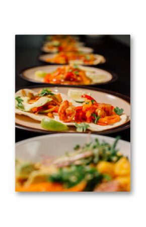 These colorful tacos, filled with fresh shrimp and peppers, are garnished with lime and perfect for any meal