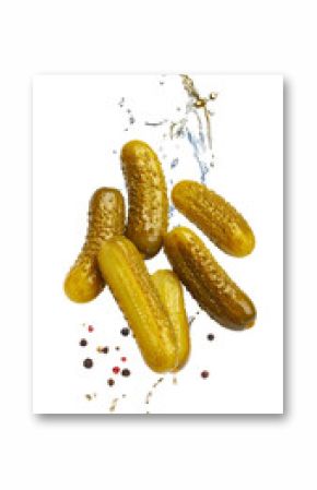 Pickled gherkins splashing with brine and peppercorns on transparent background
