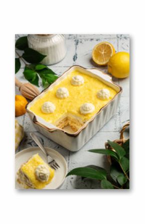 Lemon Tiramisu. Italian refreshing dessert made with cream, soaked ladifingers, lemon curd. Vertical image.