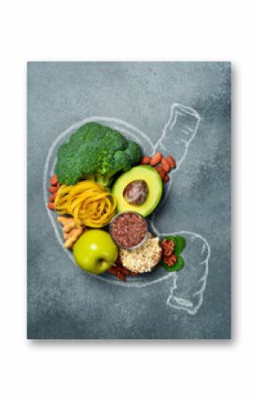 A set of fresh fruits, vegetables and nuts laid out in the shape of a stomach. A chalk drawing of a human stomach. The best foods for healthy digestion.