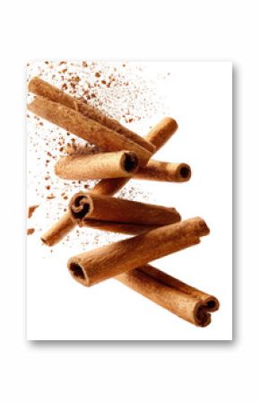 Cinnamon sticks, in motion, amidst a spray of ground cinnamon
