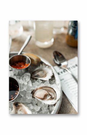 Maine clam chowder, clams, lobster, oysters plated at a restaurant with gorgeous light