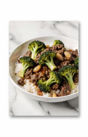 A quick and healthy weeknight dinner solution featuring a savory ground beef and broccoli stir-fry served over a bed of fluffy white rice in a simple bowl. 