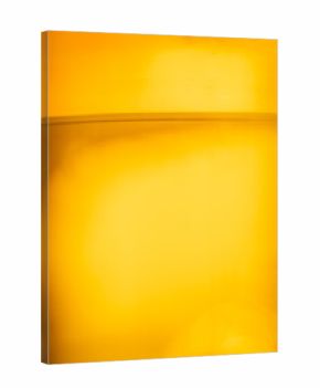 Golden beer close-up with bubbles in glass