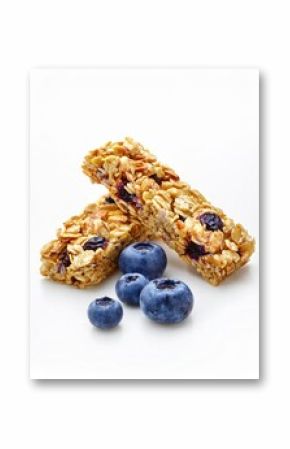 Two blueberry cereal bars with fresh blueberries on white background