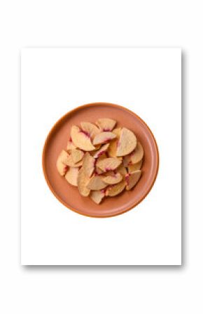 Dried sublimated slices of peach or apricot as an ingredient for sweet desserts. Dried peach