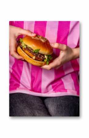Girl holding an appetizing burger in her hands