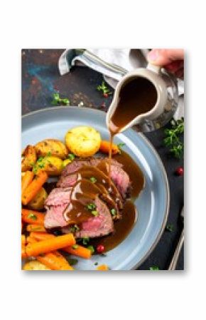 Delicious Roast Beef with Gravy and Roasted Vegetables.