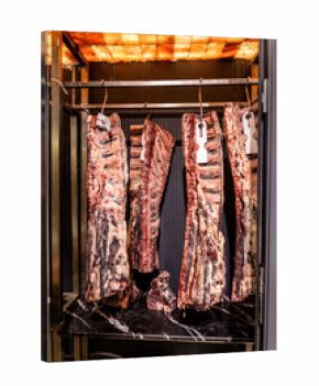 Dry aged beef ribs in meat fridge