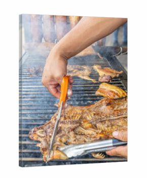 Typical food of Ecuador: guinea pig roasting on the grill, prepared with traditional Andean techniques that preserve cultural essence and offer a unique gastronomic experience.