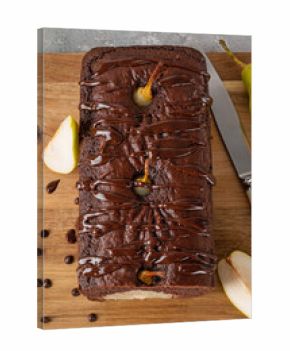 Chocolate pie or cake with whole pears and chocolate glaze on top on gray background.
