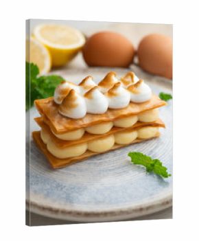 Millefeuille filled with lemon curd and meringue.