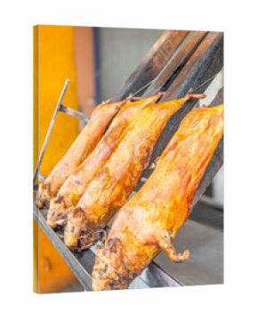 Typical food of Ecuador: guinea pig roasting on the grill, prepared with traditional Andean techniques that preserve cultural essence and offer a unique gastronomic experience.  