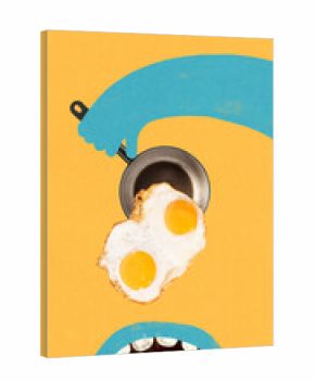 Modern composition. Blue hand holding pan with fried eggs on orange background. Concept of breakfast cooking, morning energy, culinary design, and contemporary food composition.