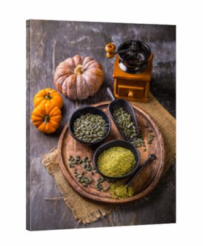 Pumpkin seed flour in a bowl with seeds, healthy food concept