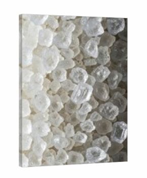 Close-up view of white sugar crystals in natural light