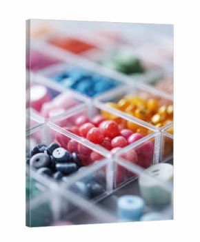 Vibrant assortment of craft supplies, buttons and beads organized in a clear container. Arts and crafts concept. Ideal for creative projects.