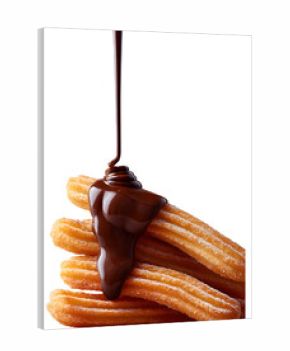 Traditional churros topped with dripping chocolate sauce isolated on transparent background, perfect for dessert designs.