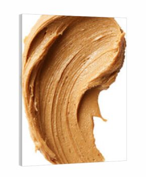 Smooth smear of rich creamy nut butter spread across a clean surface highlighting its velvety texture warm color and appetizing shine evoking comfort natural flavor and wholesome indulgence 