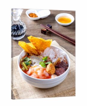 Yen Ta Fo noodles on a wooden table