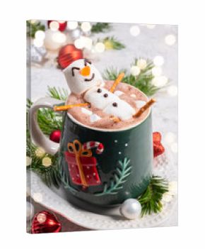 Cozy winter scene with festive hot chocolate topped by a playful snowman in a decorated mug