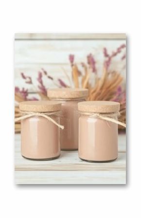 Three Glass Jars of Organic Product on Wooden Table