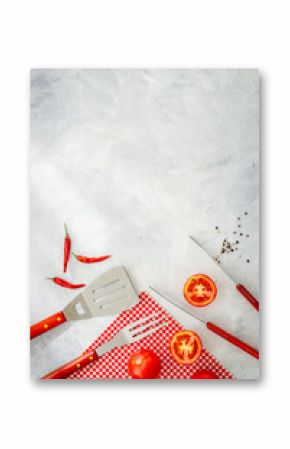 Set with barbecue utensils and equipment with red picnic napkin. Stainless steel tools. Top view