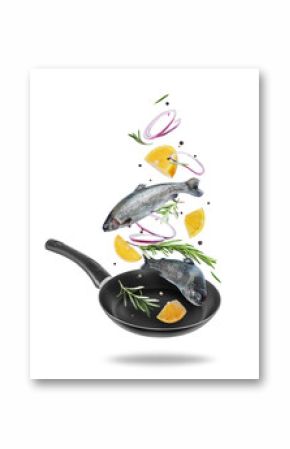 Sea trout with rosemary branches and lemon slices falling into frying pan on white background