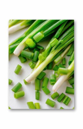 Fresh green scallions on white background with sliced pieces