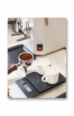 Espresso Grounds for Two Cups in Coffee Shop With Professional Machine and Scale on Professional Barista Setup Table Close up
