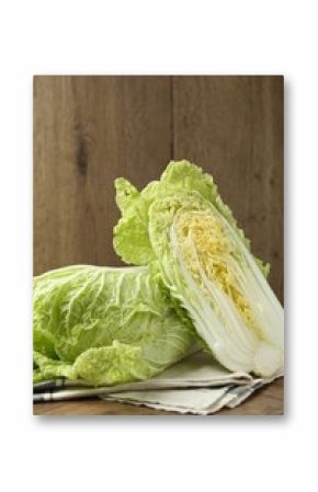 Fresh Chinese cabbages on wooden table, closeup