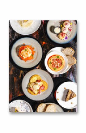 Delicious variety of gourmet dishes on rustic wooden table