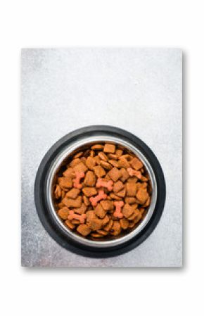 Metal Bowl with pet food. Organic grain food for dog or cat with meat flavour. Top view.