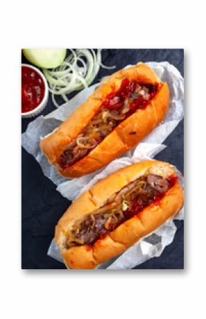 two traditional South African Boerewors rolls on black