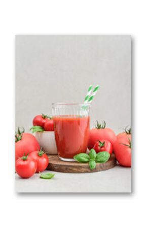 Tomato juice in a glass and fresh tomatoes