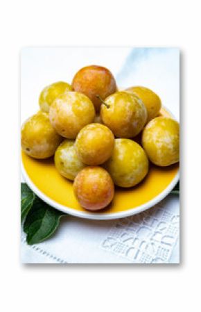 Sweet ripe small yellow mirabelle plums, healthy organic fruits close up