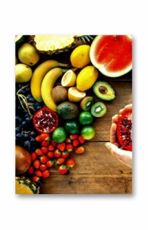 a person holding a piece of fruit in front of a bu