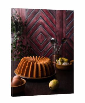 Lemon bundt cake on a wood countertop, citrus pound cake on wood background