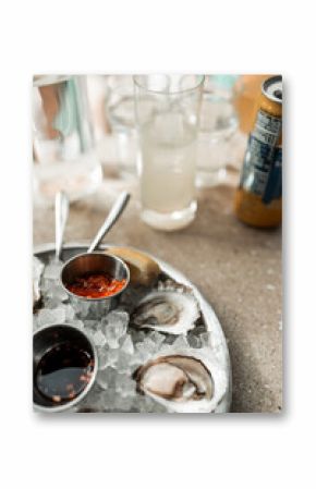 Maine clam chowder, clams, lobster, oysters plated at a restaurant with gorgeous light