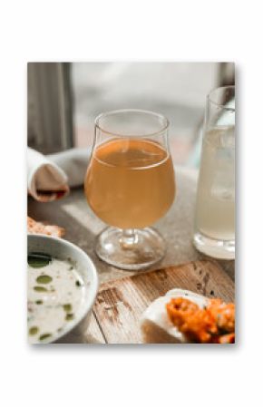 Maine clam chowder, clams, lobster, oysters plated at a restaurant with gorgeous light