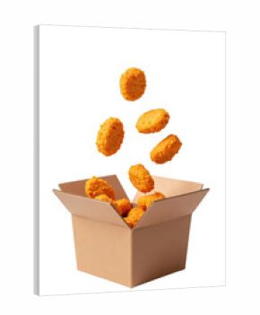 Crispy chicken nuggets falling into takeout box, showcasing delicious and appetizing snack. Perfect for fast food lovers and casual dining