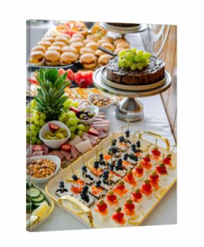 Vibrant feast for celebration. A vibrant assortment of appetizers and desserts is displayed on a table for a festive gathering with friends and family.