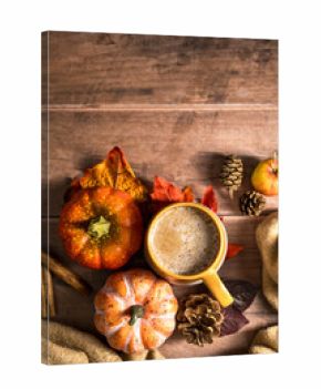 Pumpkin pie spices latte drink, cosy autumn coffee drink, orange pumpkin, cinnamon, wooden rustic background