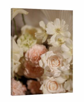 Wedding banquet table decorated with flowers, candles and food in festive hall with dark background. Concept of celebration, romance, event decoration, reception.