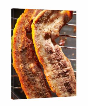 Well-grilled pork belly on the grill